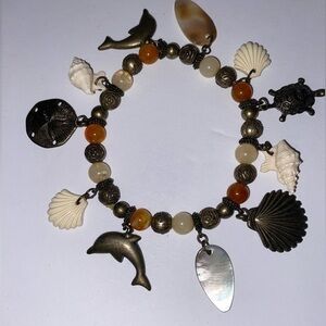 Vintage Seashell Charm Bracelet with Dolphins, Sand Dollar, Sea Turtle, Shells